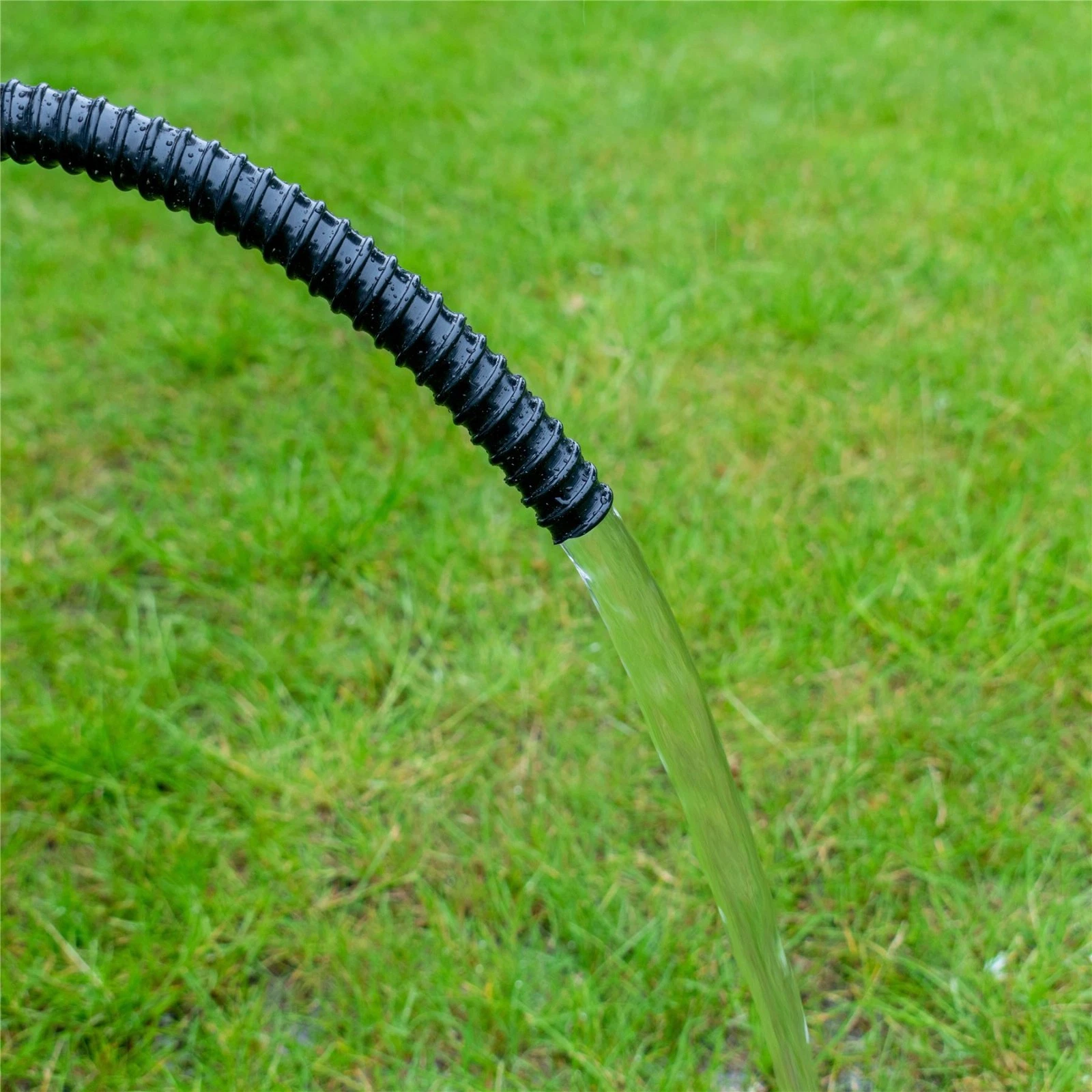 Close up view of Black Corrugated Pond Hose showing Parallel Clamp Grooves and Ribbed Texture